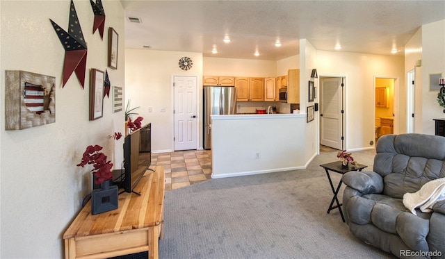 13708 Legend Trl Unit 101, Broomfield, CO 80023 - living area featuring light colored carpet, baseboards, and visible vents