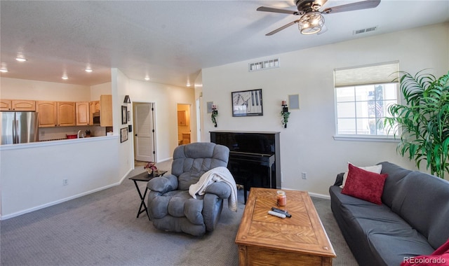 13708 Legend Trl Unit 101, Broomfield, CO 80023 - living room with ceiling fan, visible vents, and carpet flooring