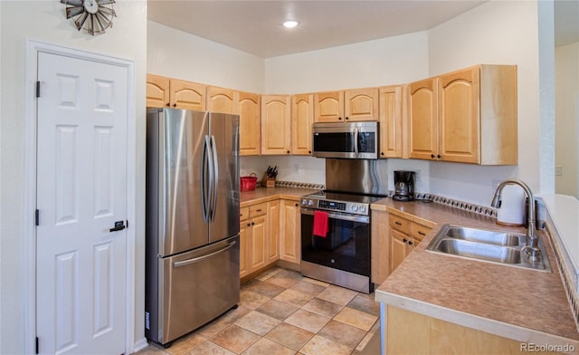 13708 Legend Trl Unit 101, Broomfield, CO 80023 - kitchen with recessed lighting, light brown cabinetry, appliances with stainless steel finishes, and a sink