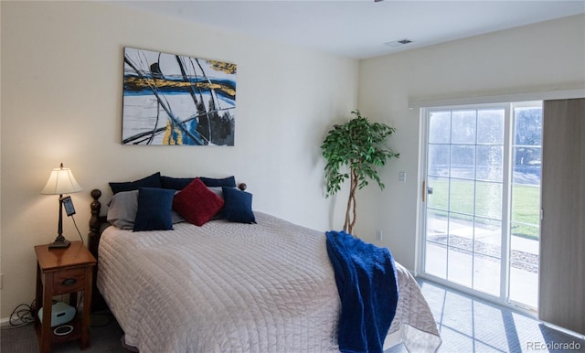 13708 Legend Trl Unit 101, Broomfield, CO 80023 - bedroom featuring access to exterior, carpet flooring, and visible vents