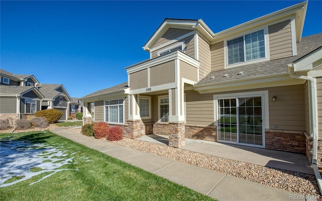 13708 Legend Trl Unit 101, Broomfield, CO 80023 - view of front of house featuring stone siding