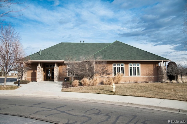 13708 Legend Trl Unit 101, Broomfield, CO 80023 - ranch-style home featuring stone siding, concrete driveway, and stucco siding
