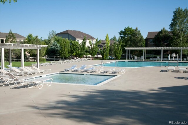 13708 Legend Trl Unit 101, Broomfield, CO 80023 - pool featuring a pergola and a patio
