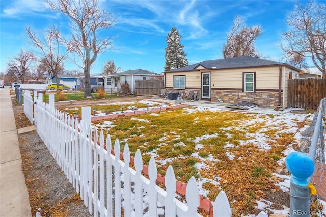 ranch-style home featuring a yard