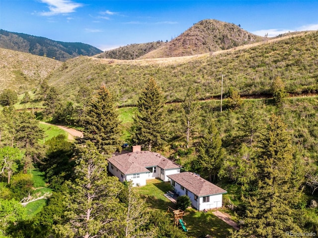 birds eye view of property featuring a mountain view