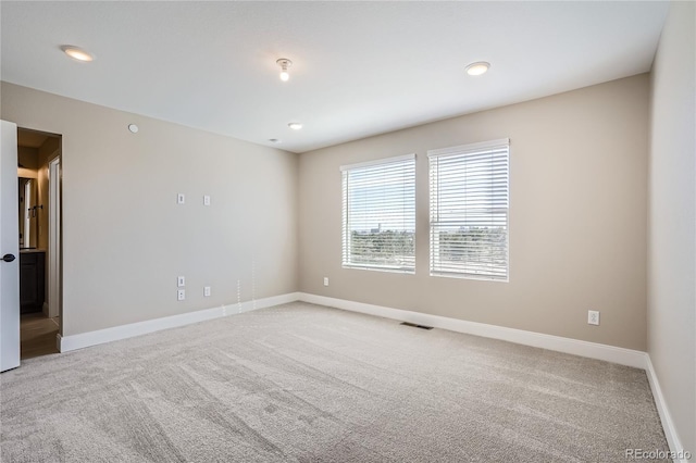 view of carpeted spare room