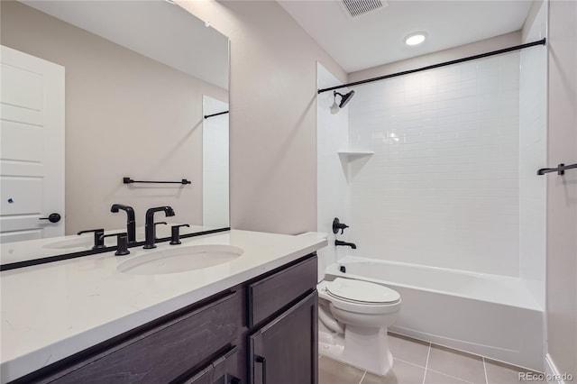 full bathroom featuring shower / tub combination, vanity, toilet, and tile patterned flooring