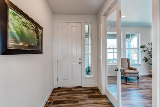 entrance foyer with french doors, baseboards, and dark wood-style flooring