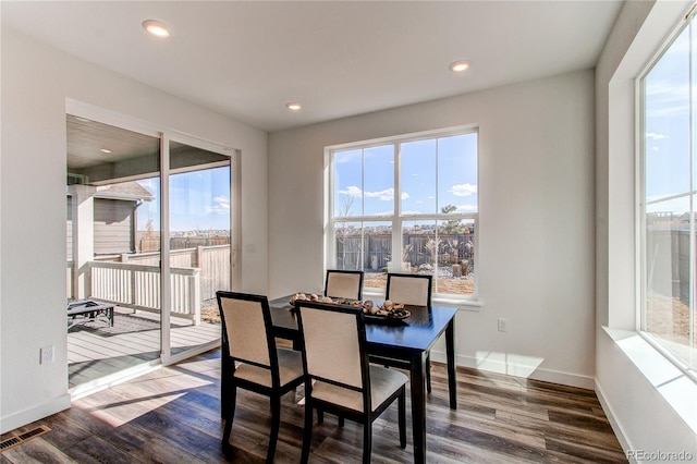 dining area with recessed lighting, baseboards, visible vents, and dark wood-style flooring