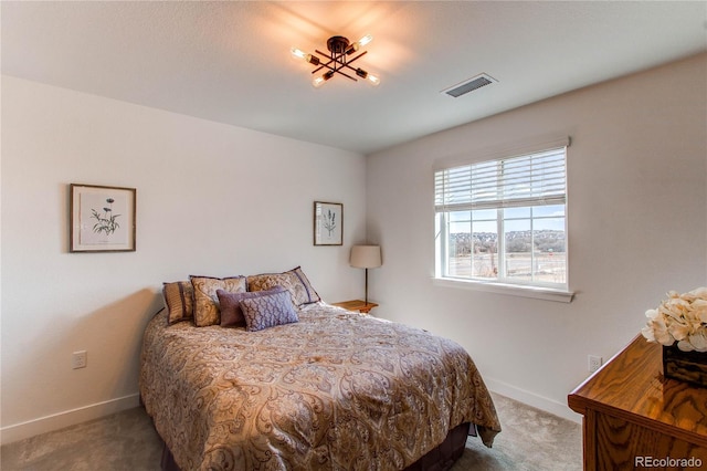 bedroom with visible vents, baseboards, and carpet floors