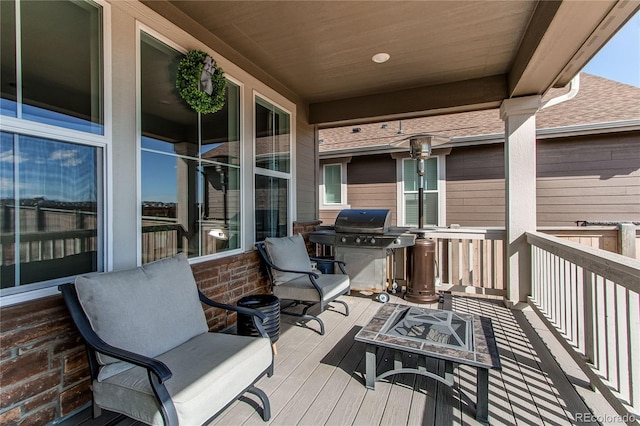 wooden deck with a grill