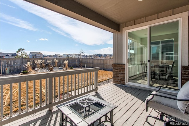 deck with a fenced backyard