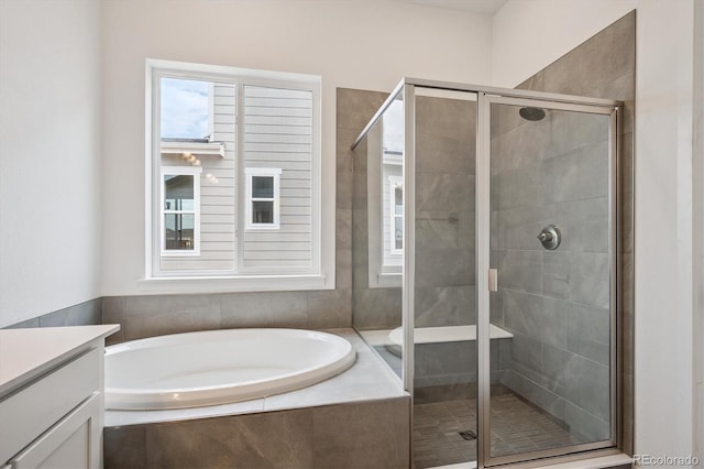9197 Ironwood St, Highlands Ranch, CO 80129 - bathroom featuring a bath, a stall shower, and vanity