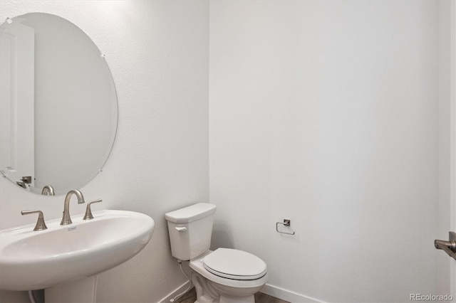 9197 Ironwood St, Highlands Ranch, CO 80129 - half bath with a sink and toilet