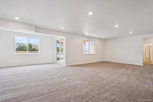 9197 Ironwood St, Highlands Ranch, CO 80129 - spare room featuring light colored carpet, plenty of natural light, and recessed lighting