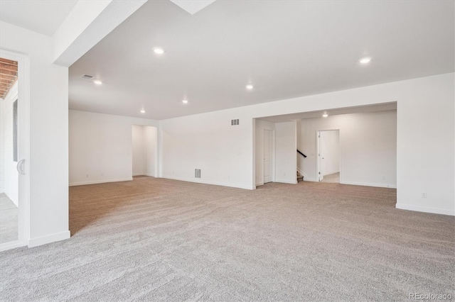 9197 Ironwood St, Highlands Ranch, CO 80129 - spare room with light carpet, recessed lighting, and stairway