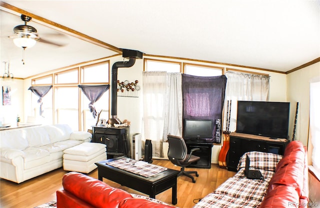 living room with a wealth of natural light, light hardwood / wood-style floors, and ceiling fan