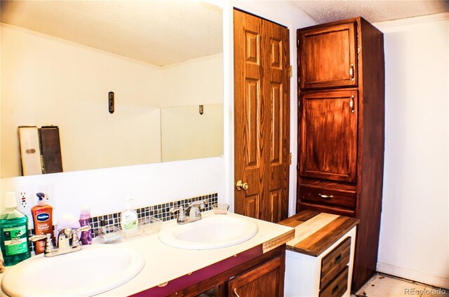 bathroom with vanity and decorative backsplash