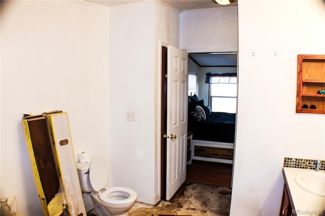 bathroom featuring vanity and toilet