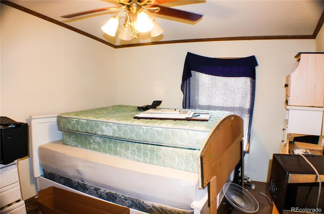 bedroom featuring ceiling fan and crown molding