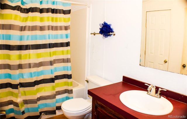 full bathroom with vanity, shower / bath combination with curtain, and toilet