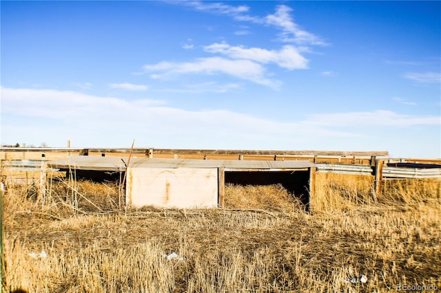 view of outbuilding with a rural view