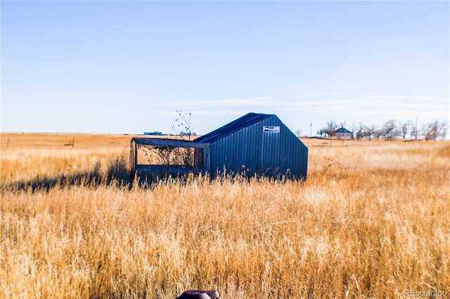 view of outdoor structure featuring a rural view