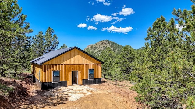 1341 County Road 327, Westcliffe, CO 81252 - view of front of home featuring driveway and a mountain view