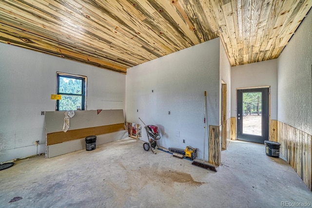 1341 County Road 327, Westcliffe, CO 81252 - unfurnished room with plenty of natural light, unfinished concrete floors, and wooden ceiling