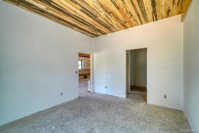 1341 County Road 327, Westcliffe, CO 81252 - empty room with concrete floors and wood ceiling