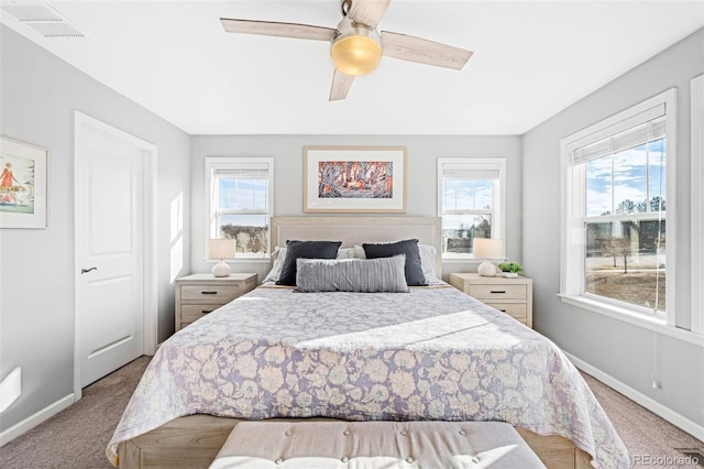 bedroom featuring light carpet and ceiling fan