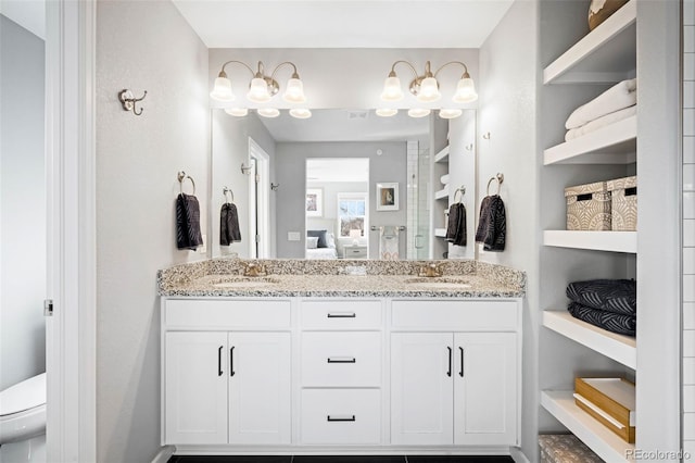 bathroom with toilet and vanity