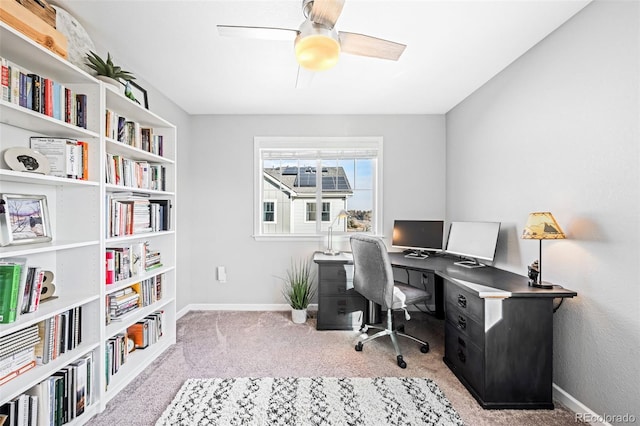 carpeted home office with ceiling fan