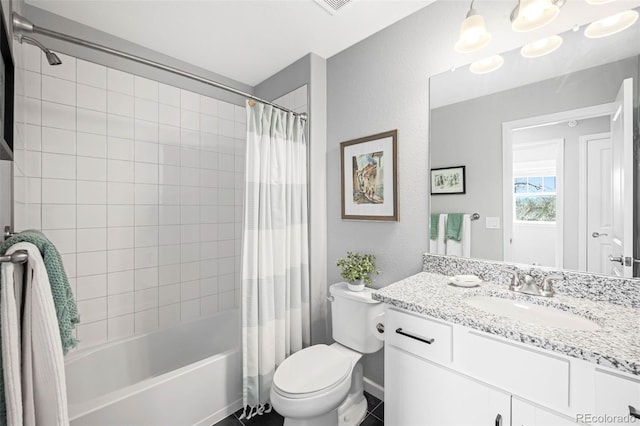 full bathroom featuring toilet, shower / tub combo, vanity, and tile patterned floors