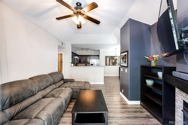 8500 E Jefferson Ave Unit 19B, Denver, CO 80237 - living room with wood finished floors, a ceiling fan, baseboards, and rail lighting