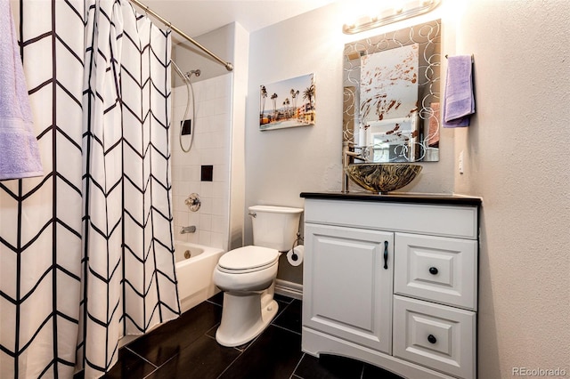 8500 E Jefferson Ave Unit 19B, Denver, CO 80237 - bathroom featuring vanity, toilet, shower / bath combo, tile patterned flooring, and a textured wall