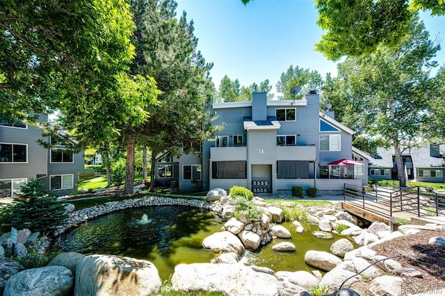 8500 E Jefferson Ave Unit 19B, Denver, CO 80237 - view of property's community with a small pond