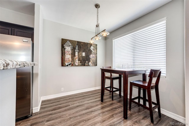 8500 E Jefferson Ave Unit 19B, Denver, CO 80237 - dining area featuring wood finished floors and baseboards