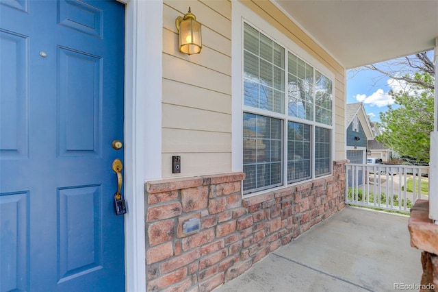 21968 E Princeton Dr, Aurora, CO 80018 - view of exterior entry featuring a porch