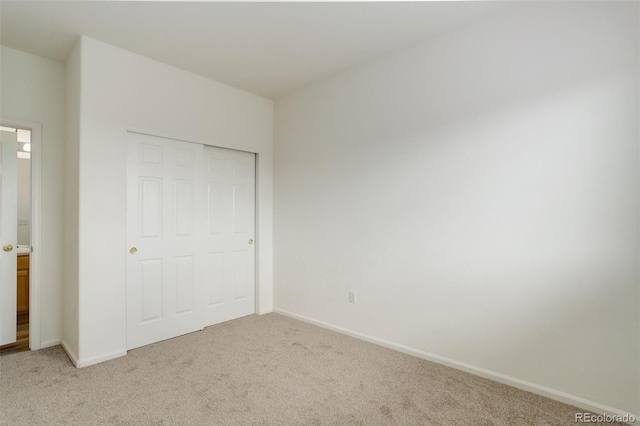 21968 E Princeton Dr, Aurora, CO 80018 - unfurnished bedroom featuring light carpet and baseboards