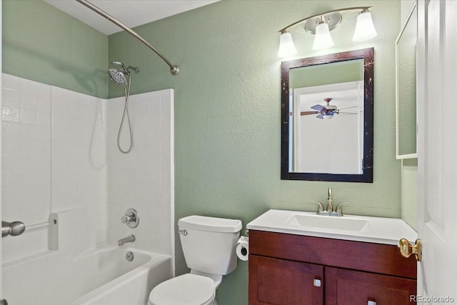 full bathroom with toilet, a textured wall, bathing tub / shower combination, and vanity