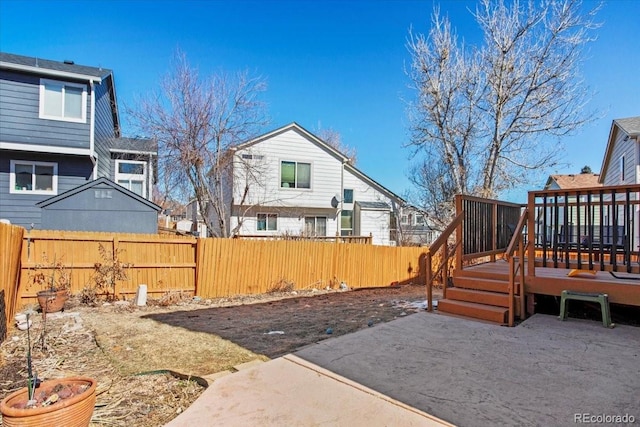 view of yard with fence private yard and a wooden deck