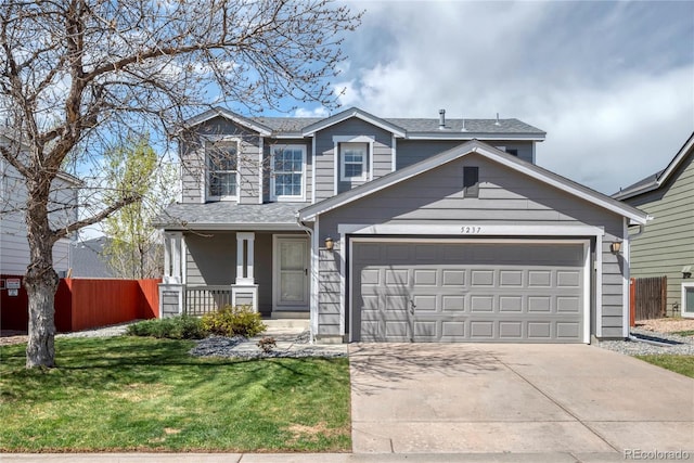 traditional home with a porch, fence, a front lawn, concrete driveway, and an attached garage