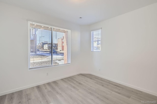 unfurnished room featuring light hardwood / wood-style flooring