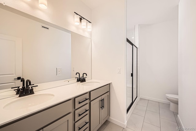 bathroom featuring vanity, toilet, tile patterned floors, and walk in shower