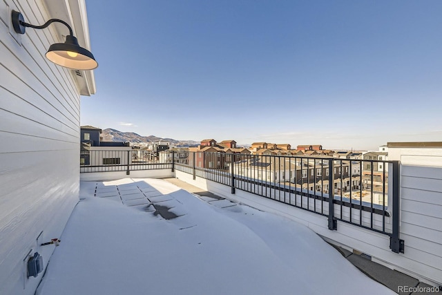 view of patio with a mountain view and a balcony