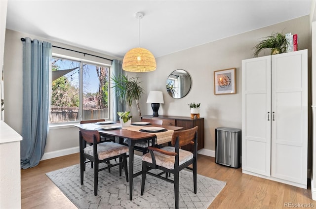 dining area featuring light wood-type flooring