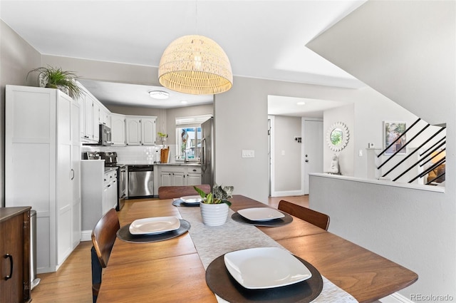 dining area with light hardwood / wood-style flooring