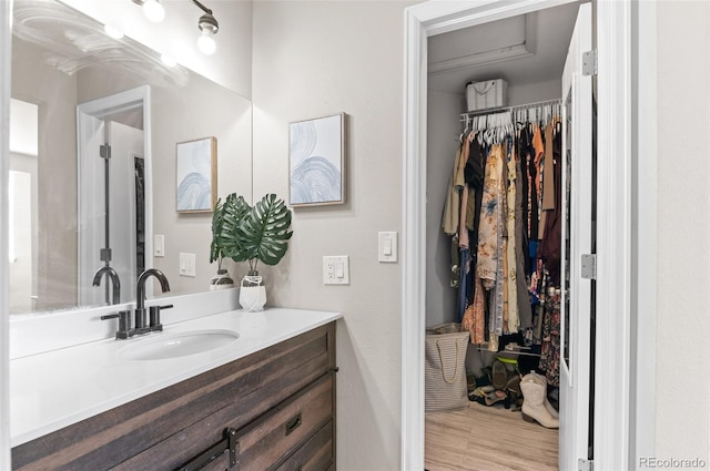 bathroom with vanity and hardwood / wood-style flooring