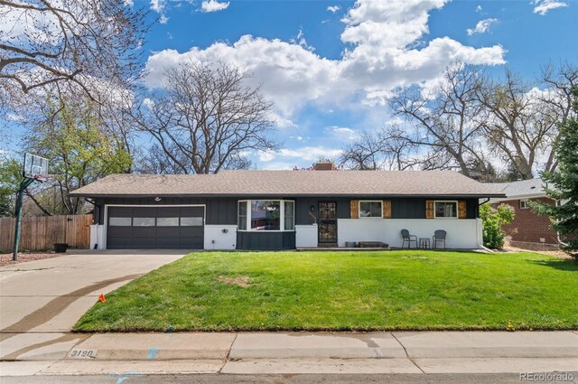 3190 Ward Ct, Wheat Ridge, CO 80215 - ranch-style home with an attached garage, concrete driveway, board and batten siding, and a chimney